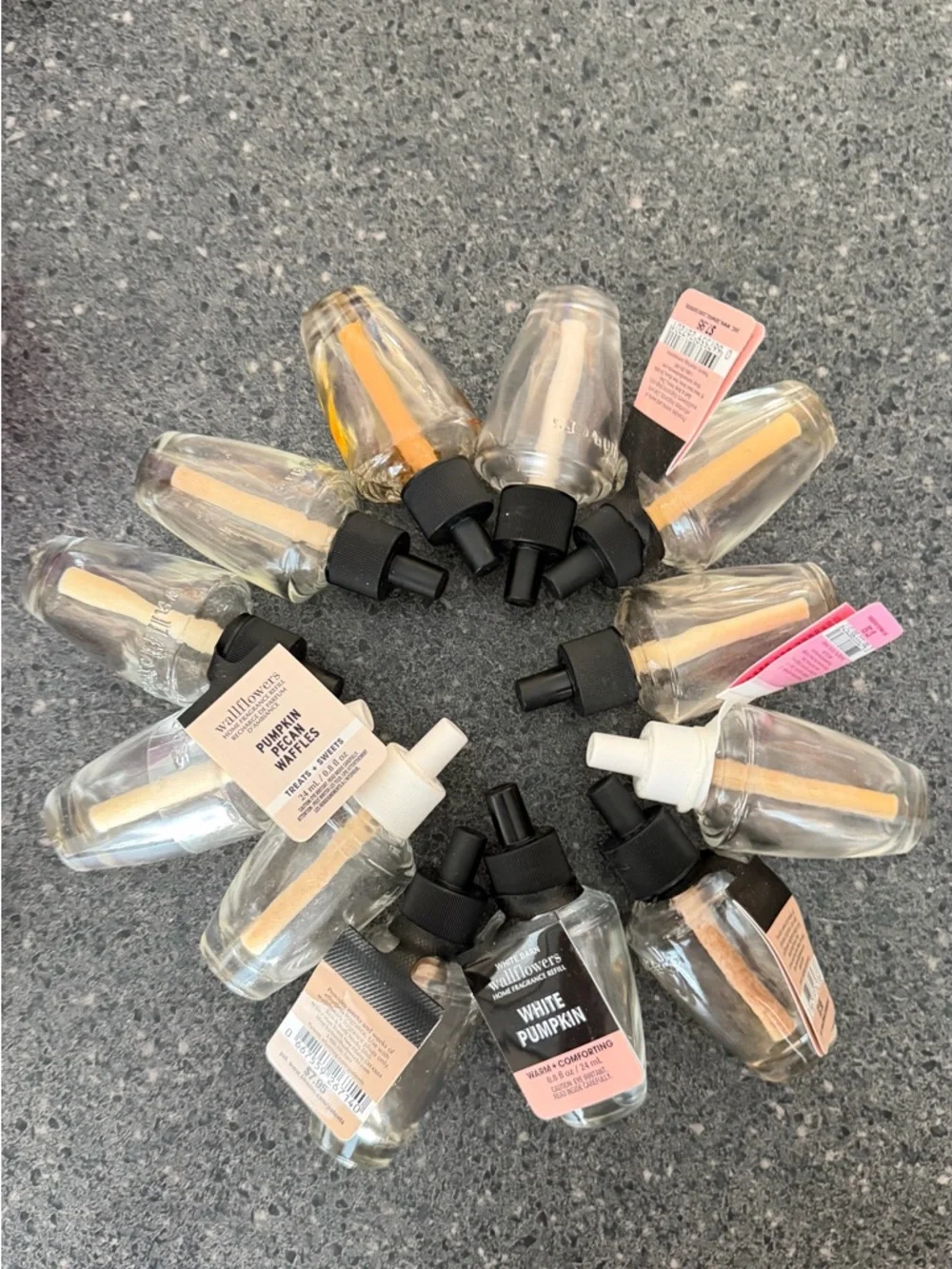 12 Empty wallflower refill bottles